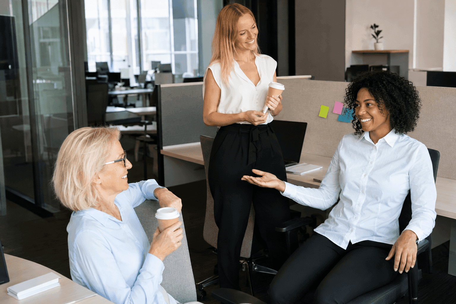 Colleagues chatting together in the office