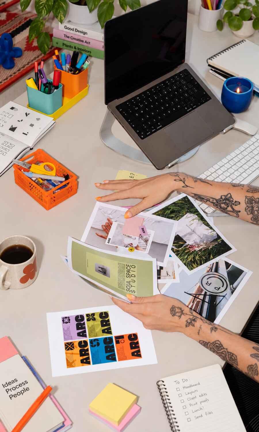Laptop and design materials on a creative workspace